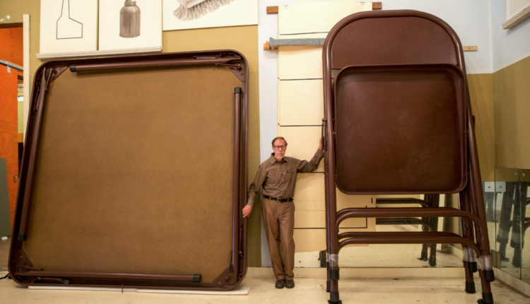 Robert Therrien with his sculptures